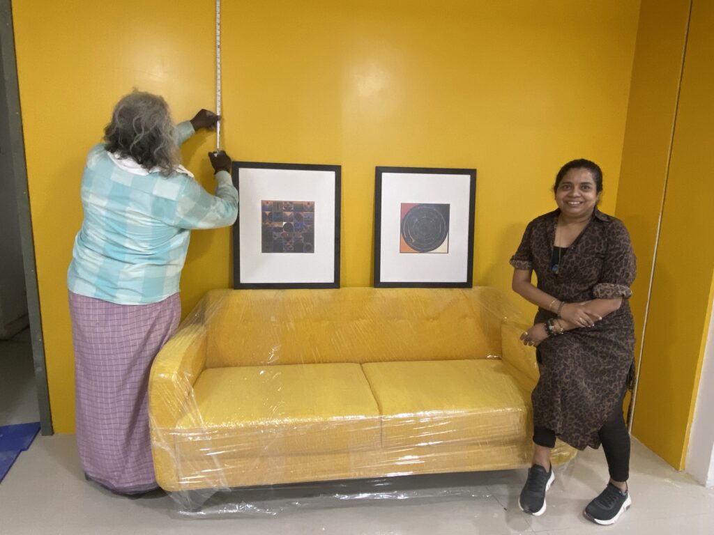 Space Studio Chennai team completing the final styling and artwork installation for the Atomberg office in Chennai before project handover.
